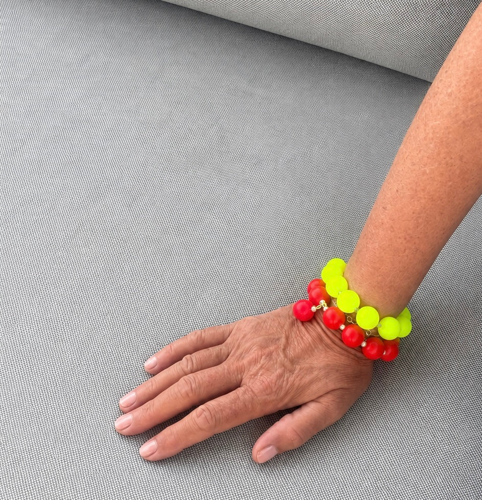 Neon silicone beaded bracelet with blue beaded drop