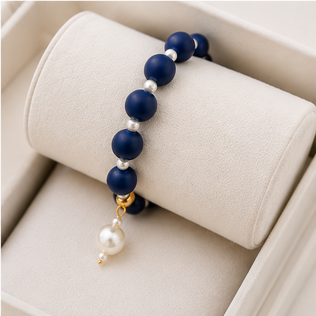 Navy silicone beaded bracelet with pearl spacers and a navy drop bead