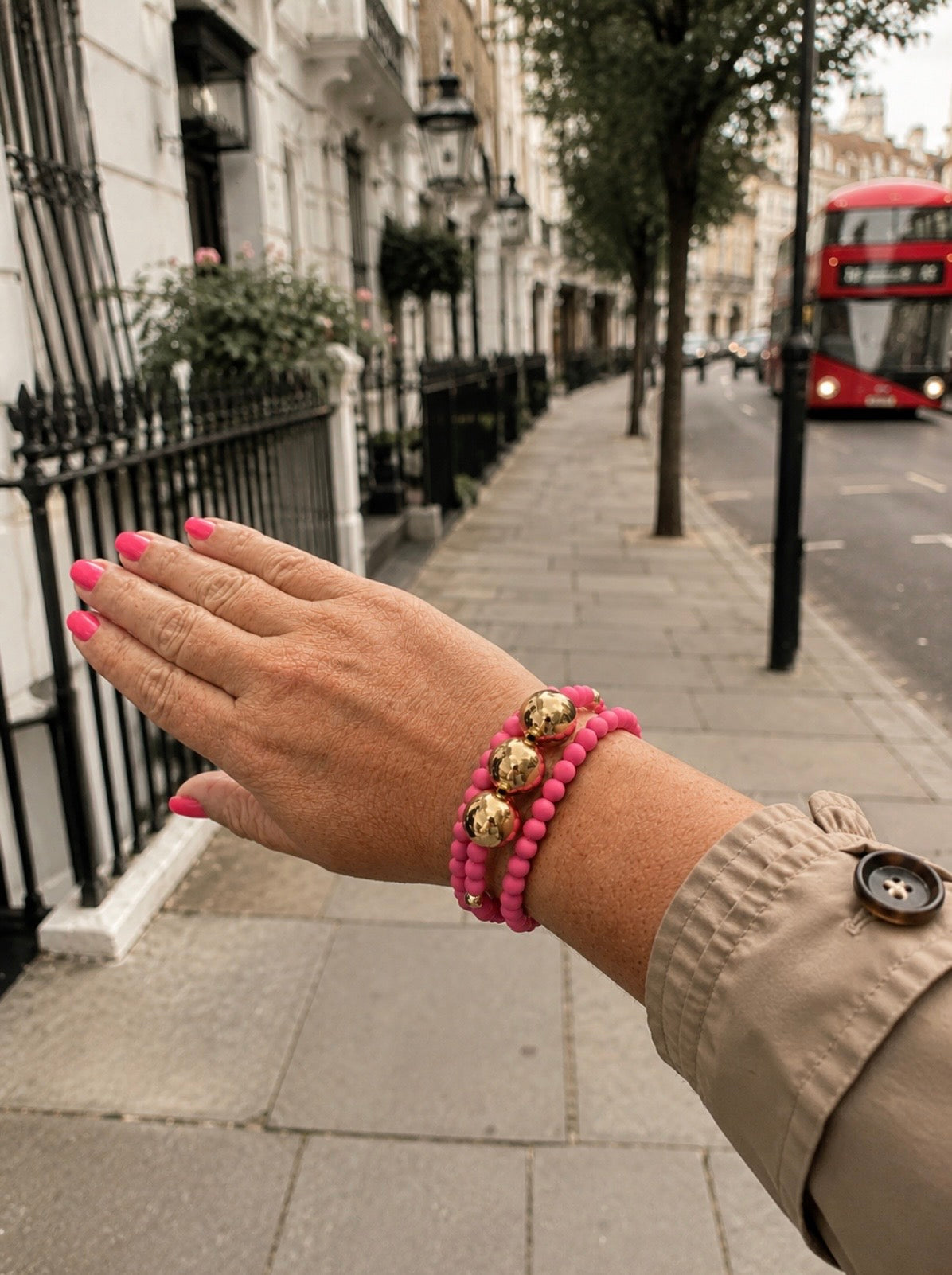 The pink and gold beaded bracelet stack