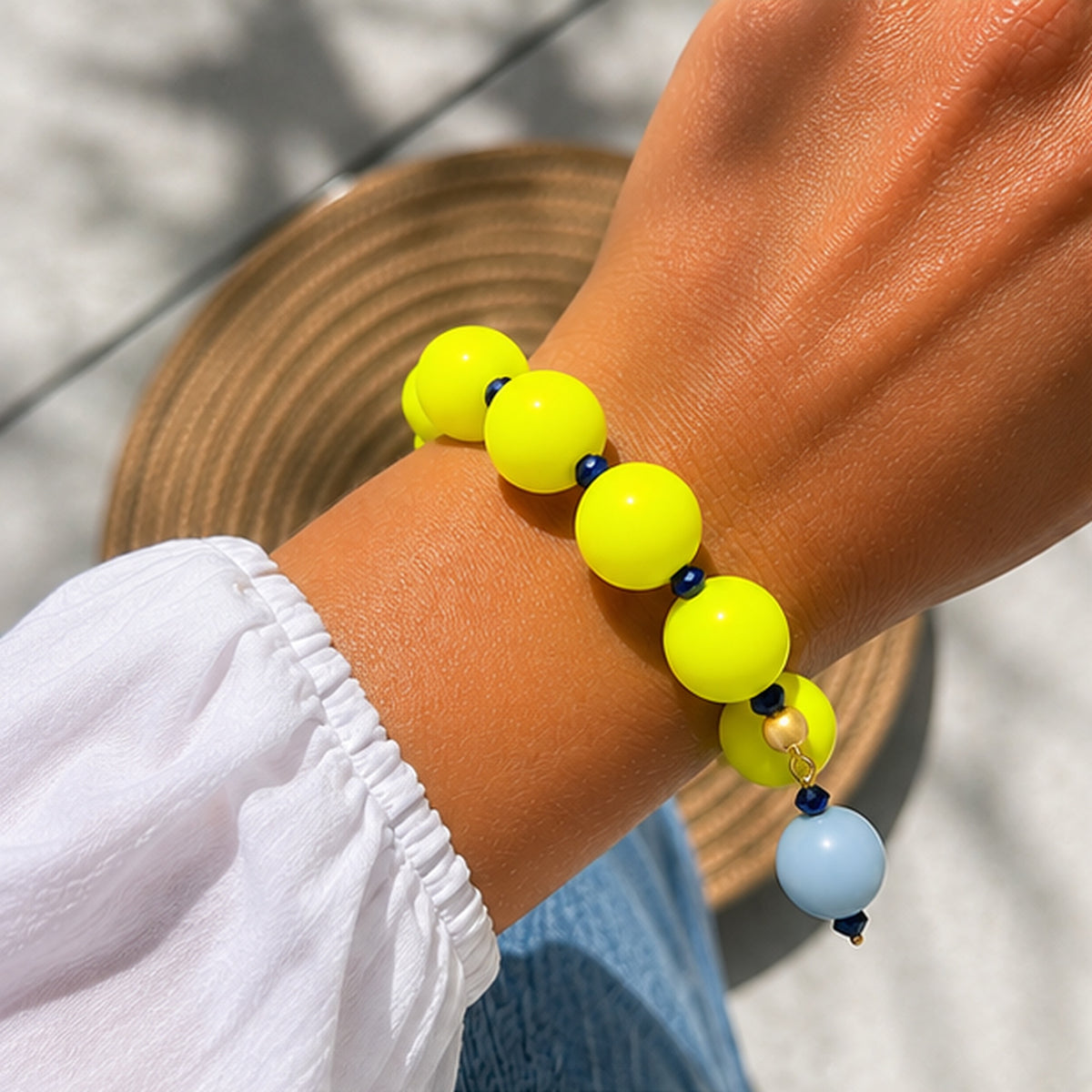 Neon silicone beaded bracelet with blue beaded drop