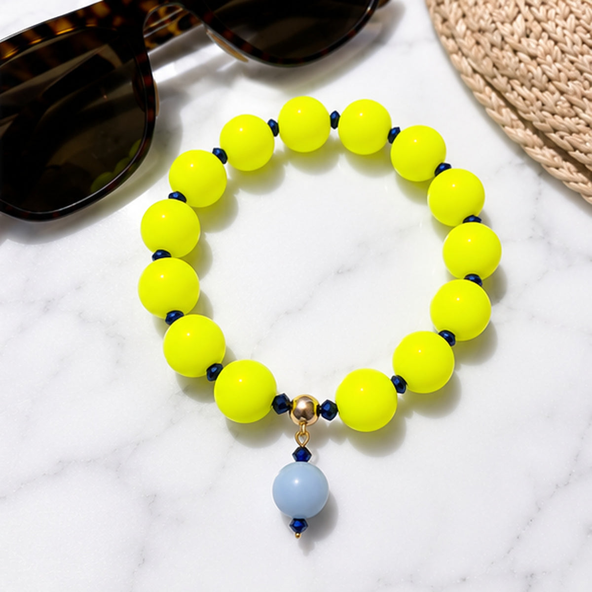 Neon silicone beaded bracelet with blue beaded drop