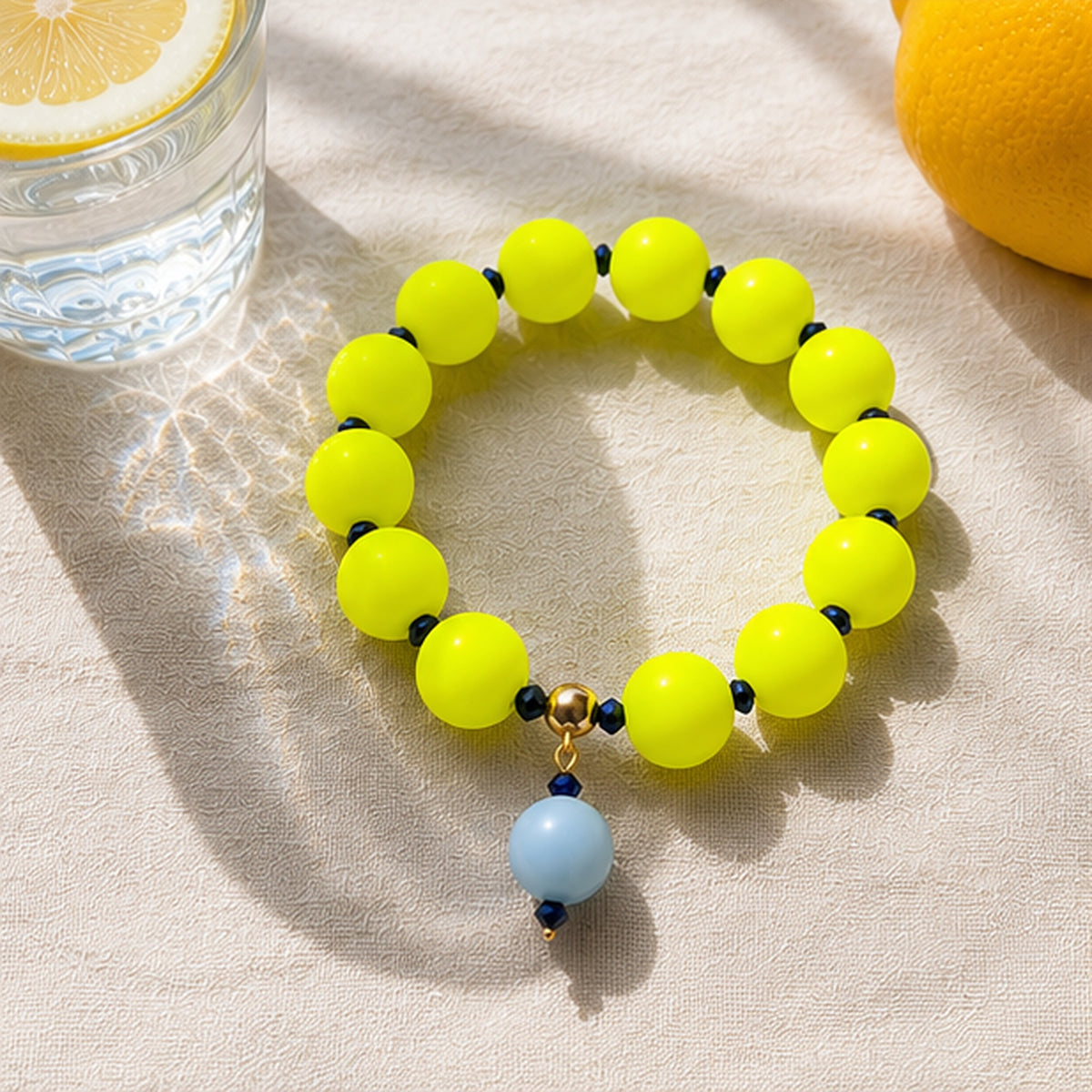 Neon silicone beaded bracelet with blue beaded drop