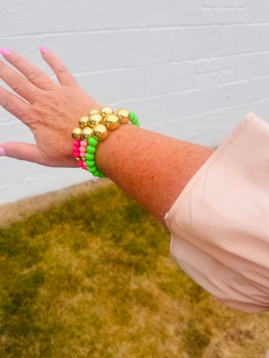 Bright Pink and gold beaded bracelet