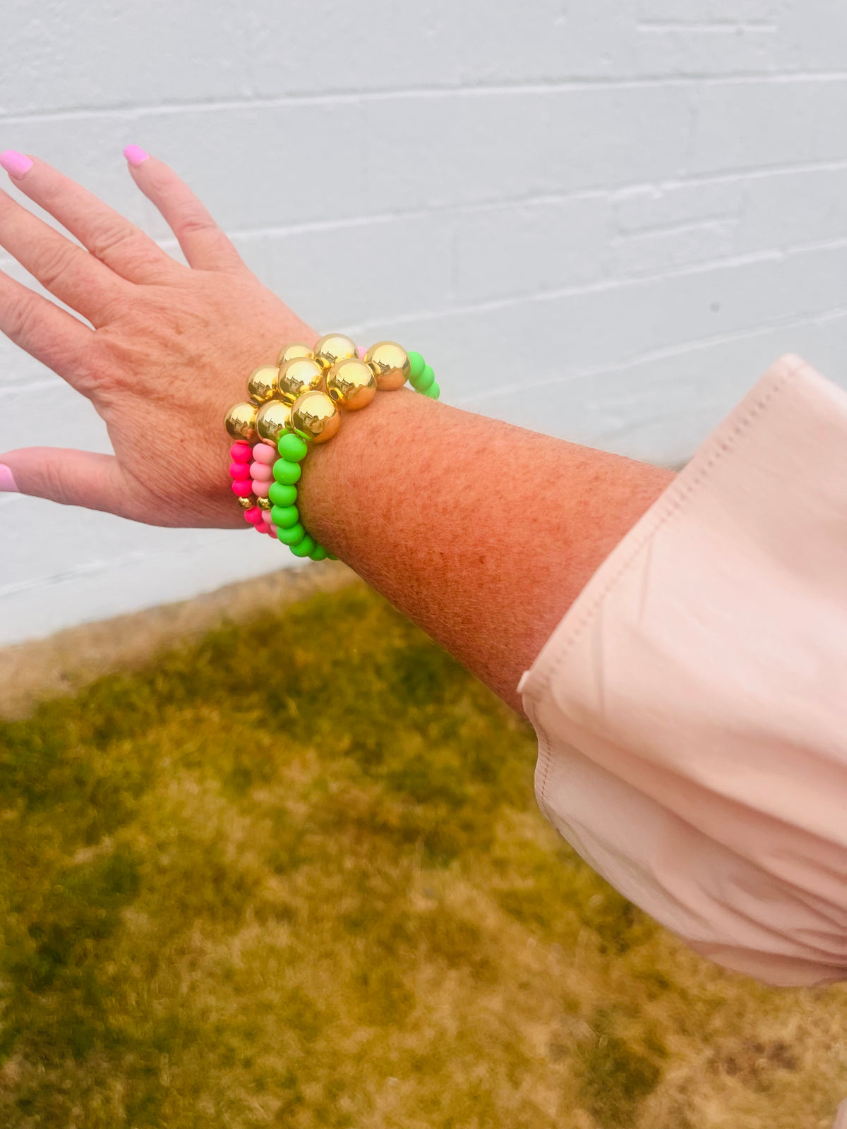 Bright Pink and gold beaded bracelet
