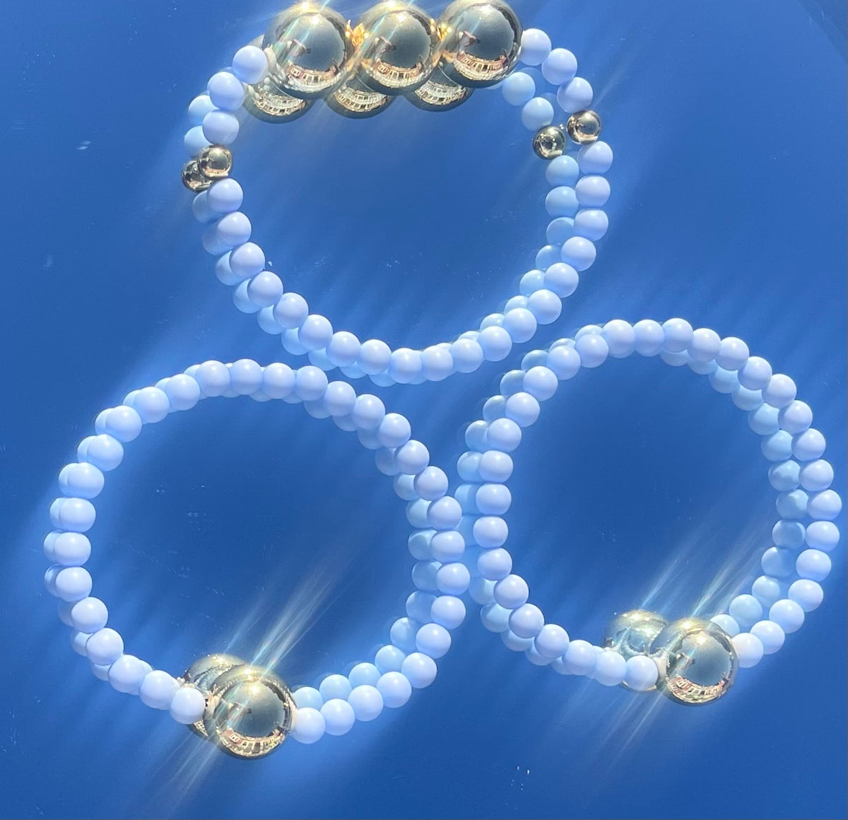 Light blue and gold bracelet stack