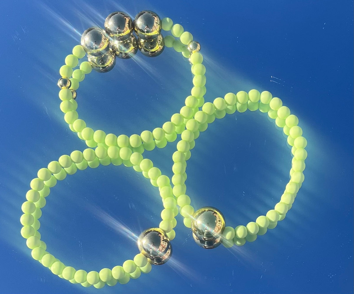 Light lime green and gold bracelet stack